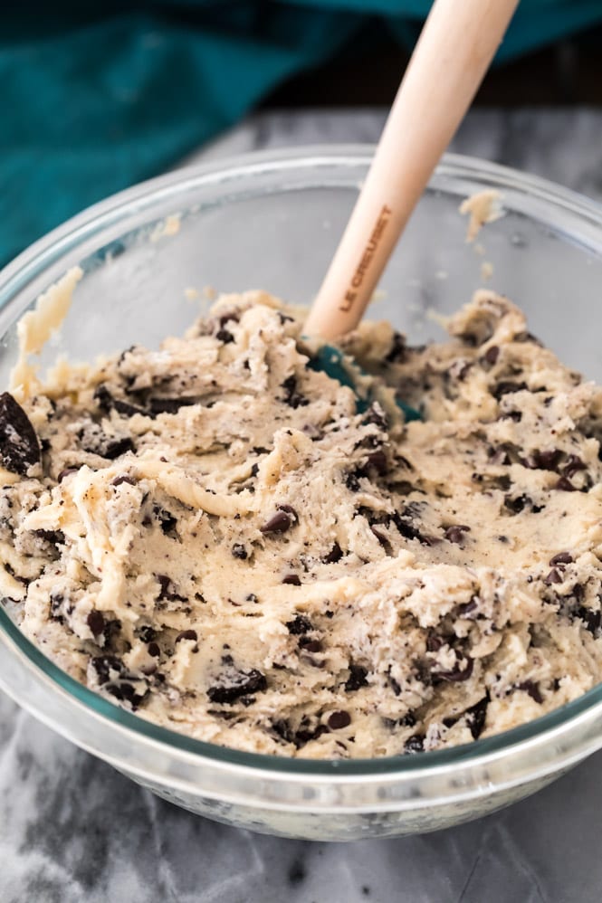 cookies and cream cookie dough in a glass bowl 