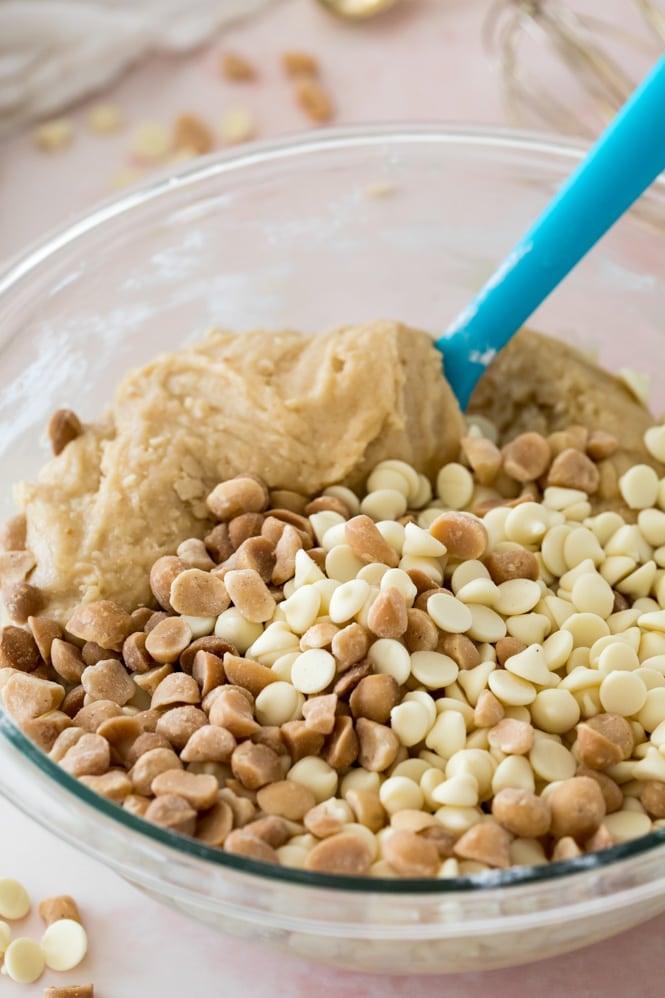 Making white chocolate chip macadamia nut cookie dough: stirring in a glass bowl