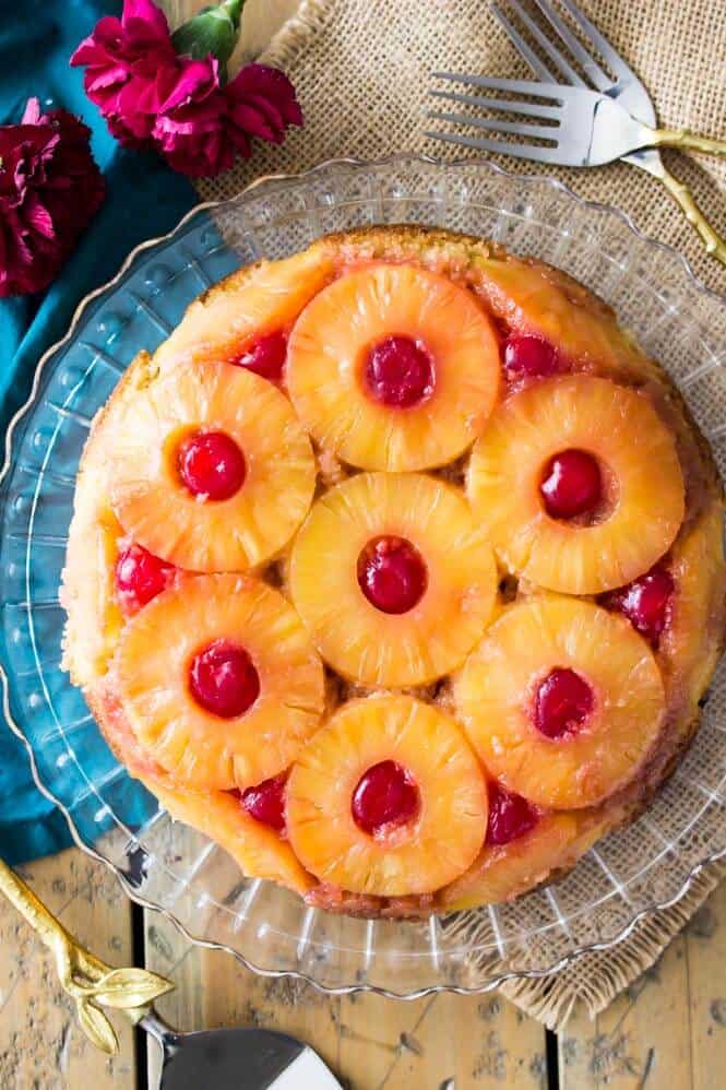 Overhead of pineapple upside-down cake on crystal platter