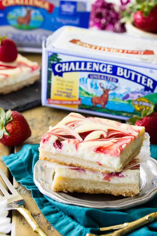 Berry Swirl Cheesecake Bars, a strawberry swirled lemon cheesecake on a shortbread crust