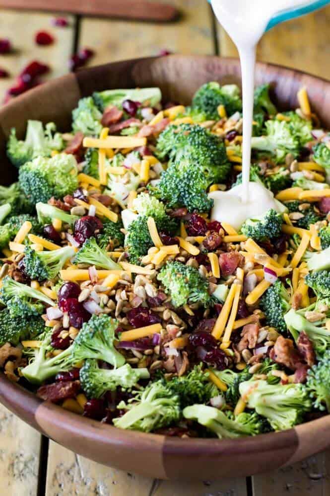 How to make broccoli salad, combining ingredients and tossing with homemade dressing