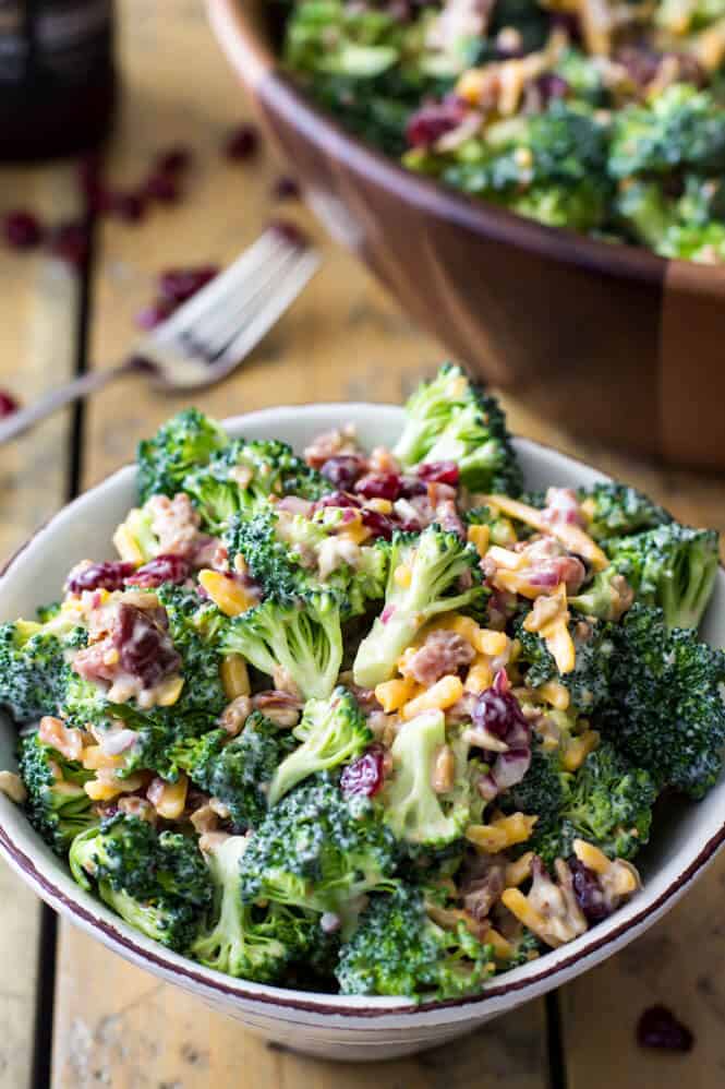 White bowl filled with broccoli salad with bacon
