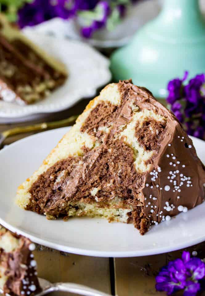 Slice of chocolate marble cake with chocolate buttercream frosting