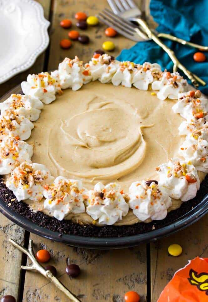 Peanut Butter Pie with whipped cream and reese\'s pieces