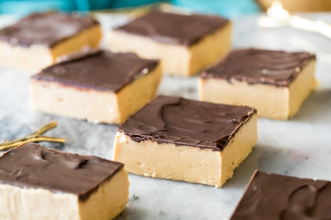 7 chocolate covered peanut butter bars on a marble board