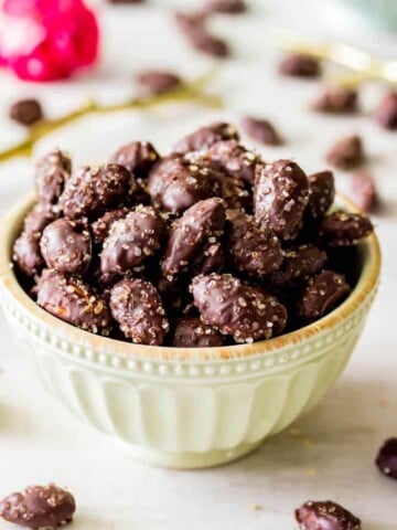 Dark Chocolate covered almonds in bowl