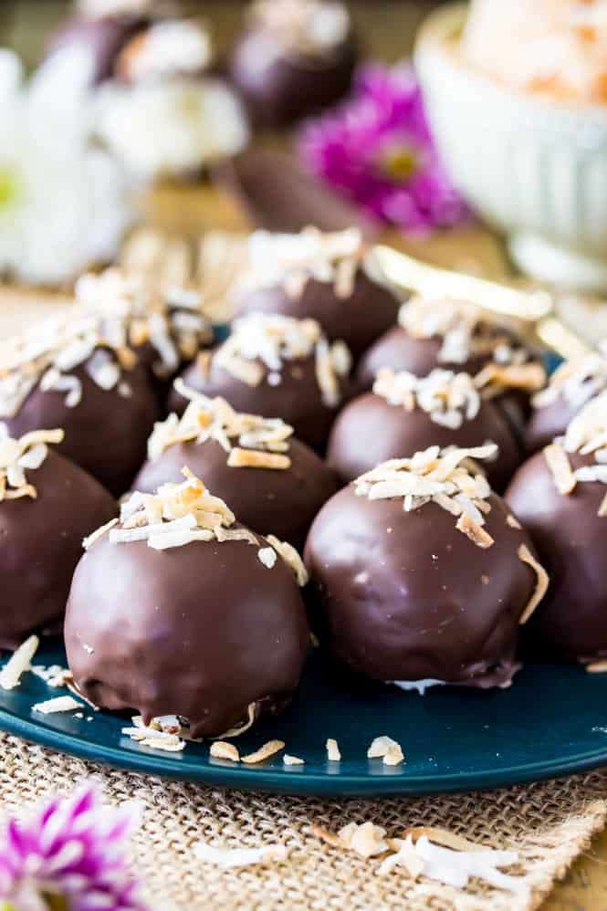 Homemade coconut truffles topped with toasted coconut