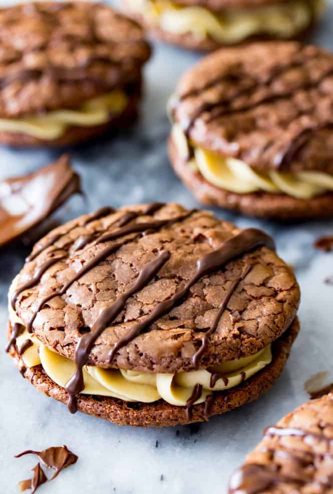 Chocolate caramel sandwich cookie with chocolate drizzled on top