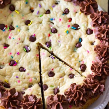 Chocolate chip cookie cake with slice cut