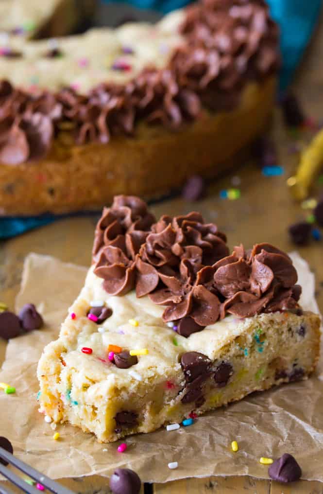 A slice of chocolate chip cookie cake! Complete with sprinkles and chocolate frosting! || Sugar Spun Run