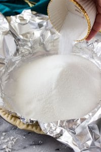 Sugar poured into foil on top of pie crust