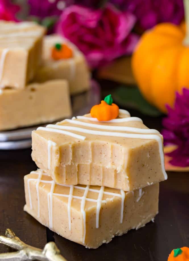 Two pieces of pumpkin fudge decorated with white chocolate