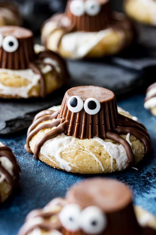 Adorable Spider Cookies made from chocolate peanut butter cups decorated on peanut butter cookies