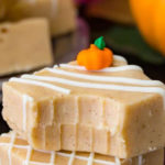 pumpkin fudge stacked on top of each other with bite missing from top piece