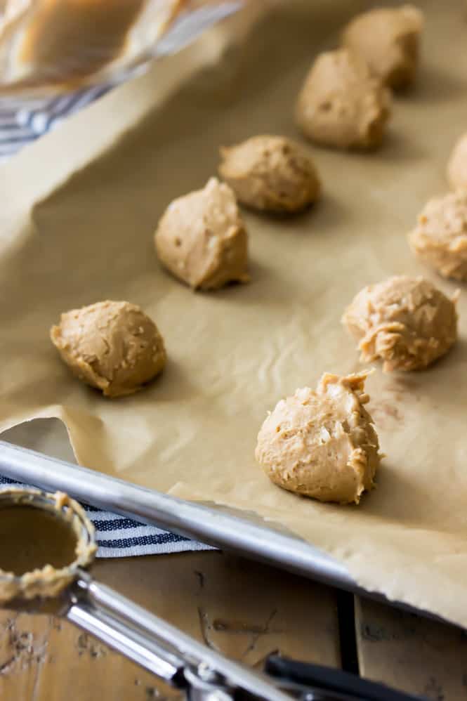 Peanut butter ball of dough on cookie sheet