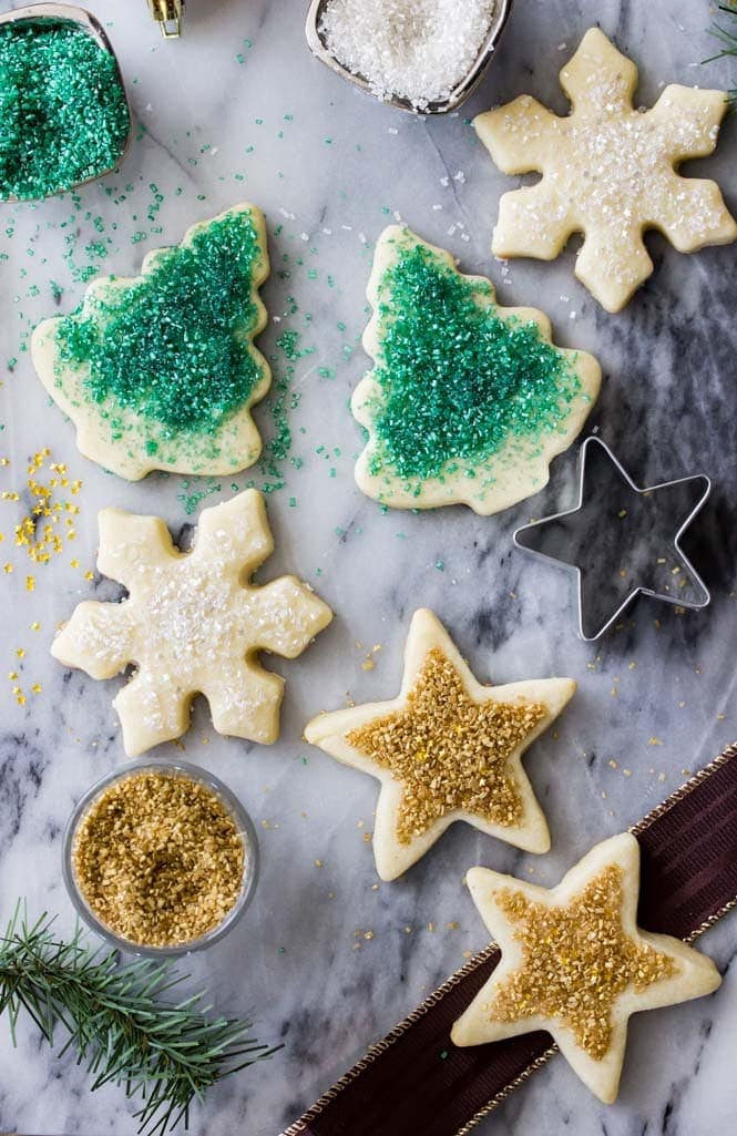 Sugar cookies shaped as stars, tress, and snowflakes