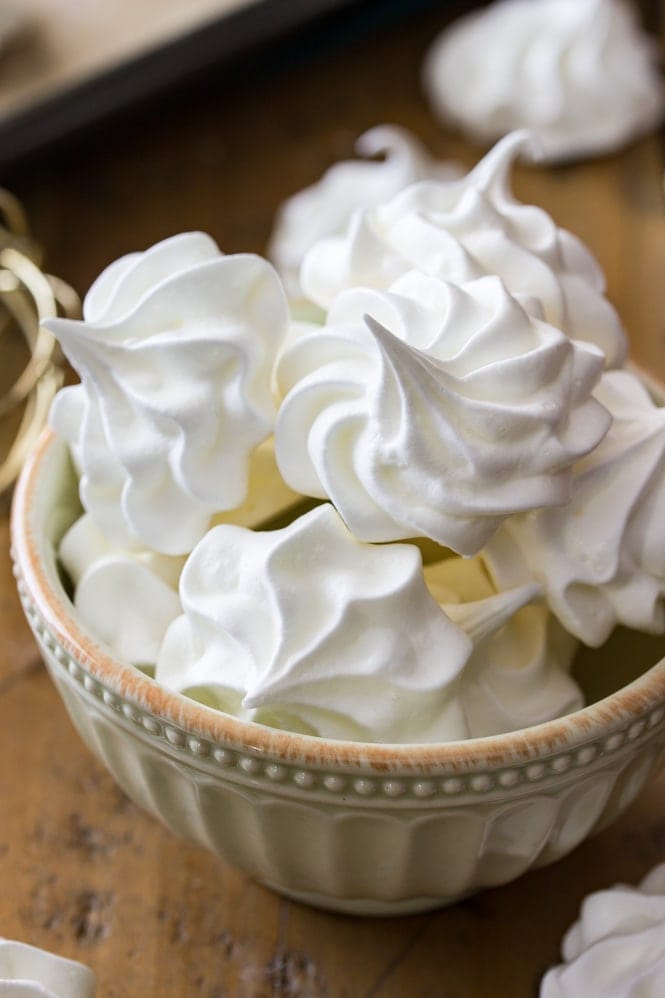 A bowl of white meringue cookies