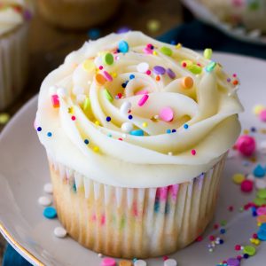 Funfetti cupcake topped with frosting and sprinkles