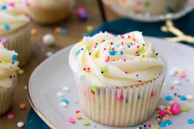 Funfetti cupcake topped with frosting and sprinkles