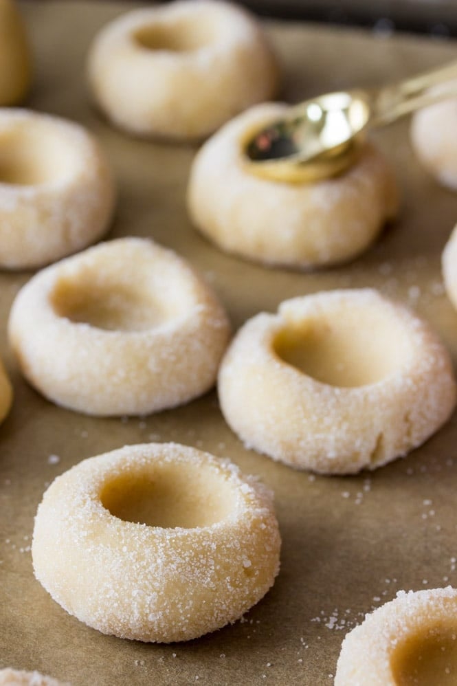 Indenting thumbprint cookies using a teaspoon