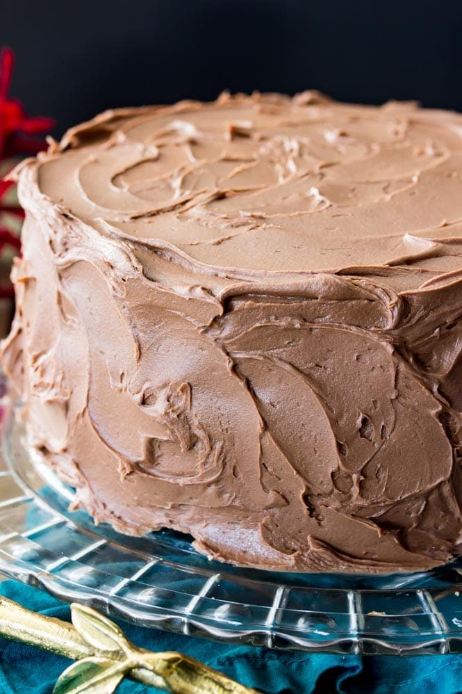 Chocolate frosted cake on cake plate