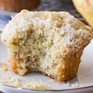 Banana muffin on plate with bite taken out