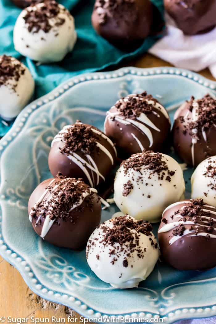 Oreo Truffles decorated with cookie crumbs on a blue plate