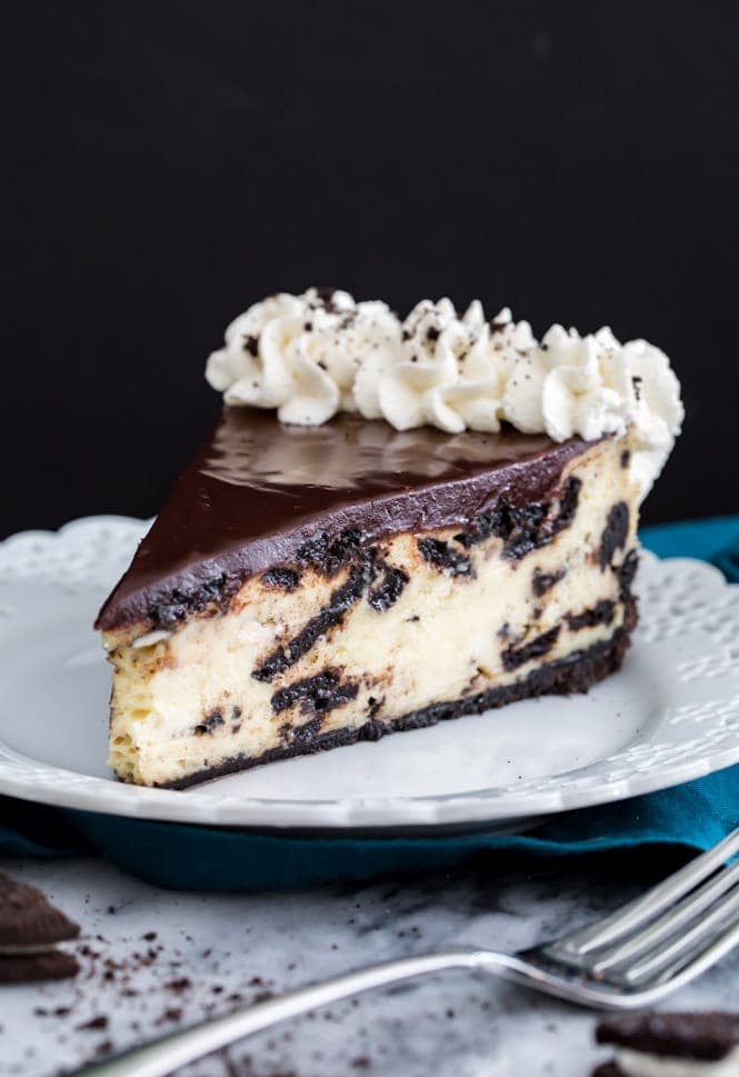 Slice of Oreo Cheesecake on a white plate