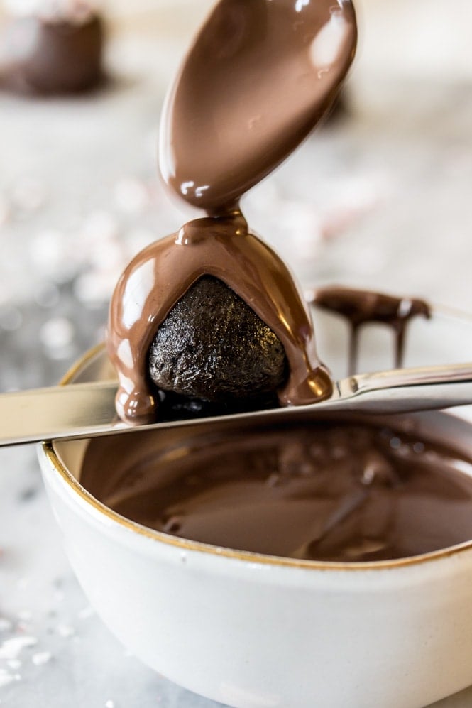 Coating oreo balls with melted chocolate