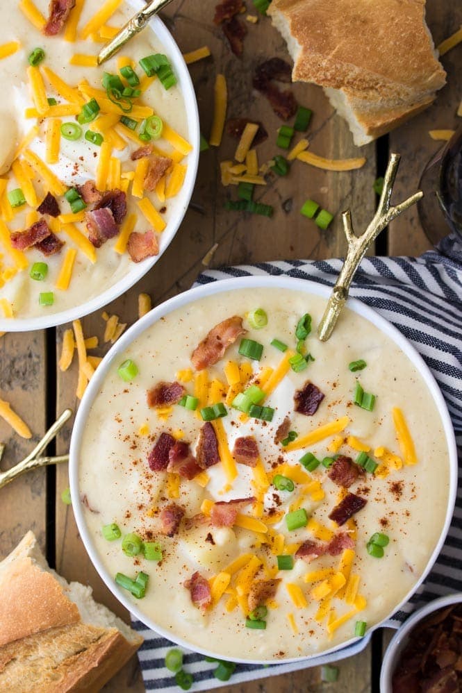 An overhead view of a bowl of potato soup