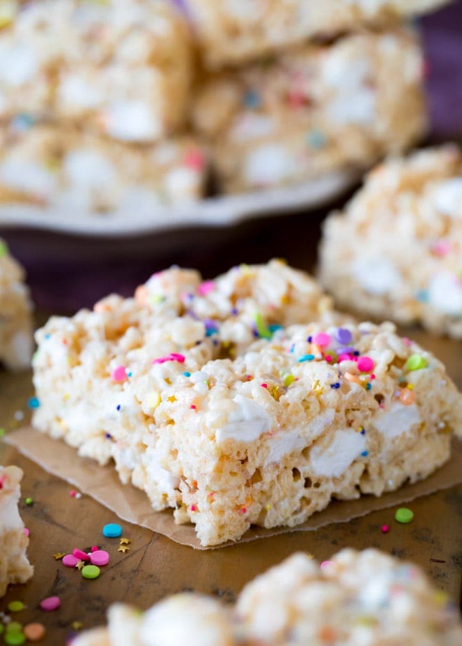 Rice Krispie Treat with sprinkles on parchment paper