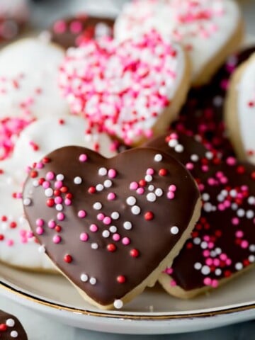 Heart shaped cookies with icing and sprinkles