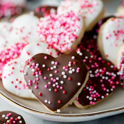 Heart shaped cookies with icing and sprinkles