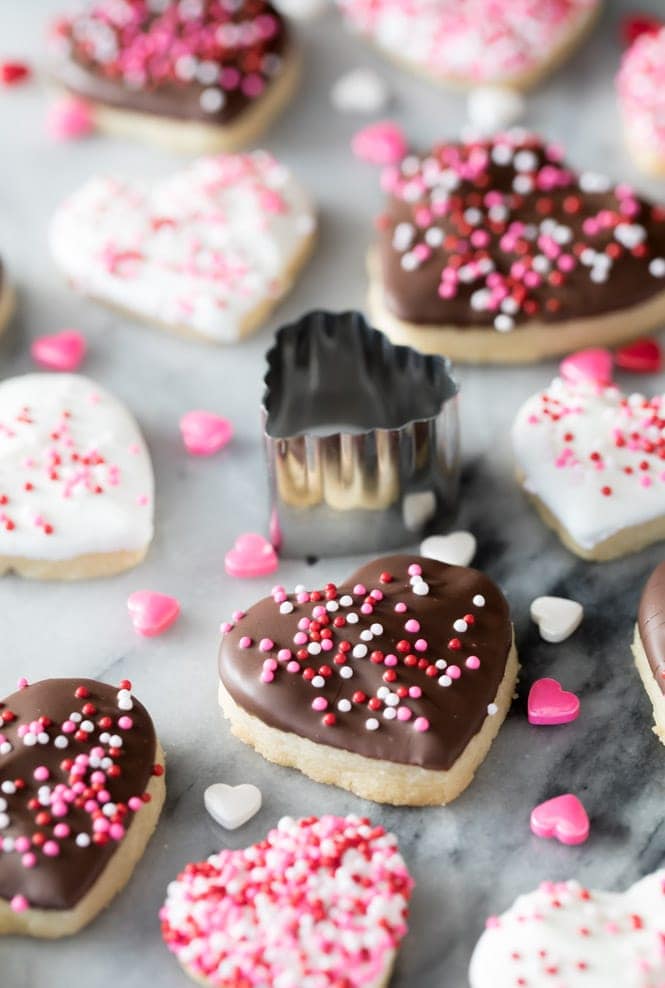 Heart shaped cookies with icing and sprinkles