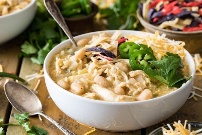 White chicken chili in a bowl with toppings