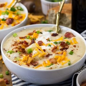 Potato soup in bowl, with toppings