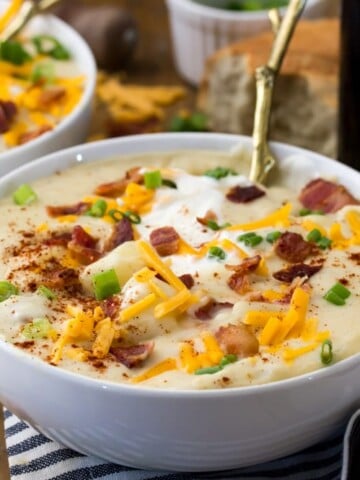 Potato soup in bowl, with toppings