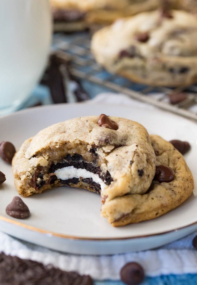 Oreo Stuffed Chocolate Chip Cookie with a bite taken out of it, showing the cookie center