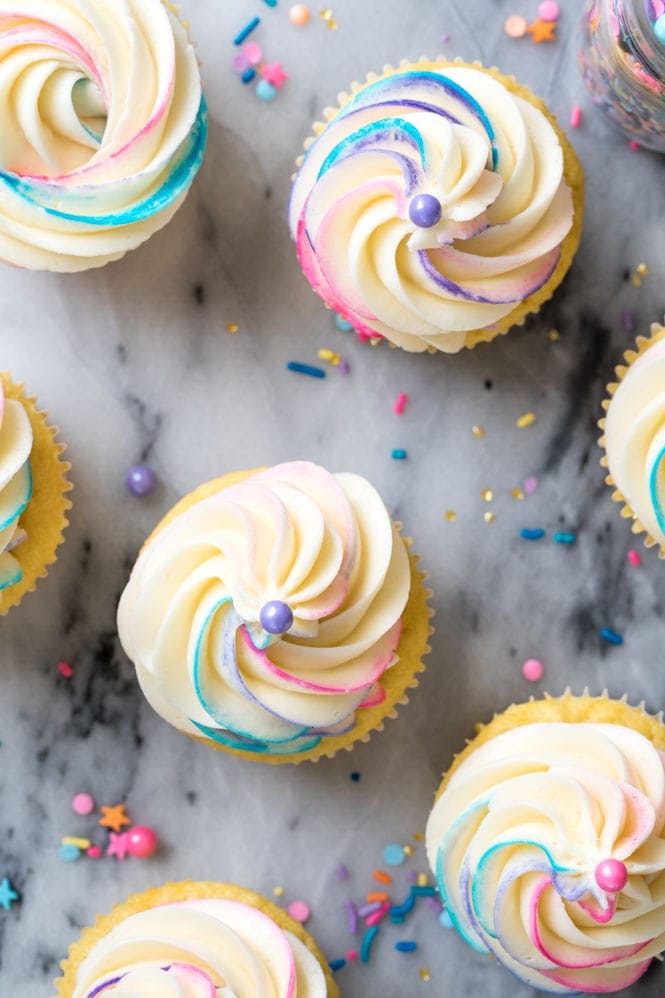 Overhead view of frosted pinata cupcakes