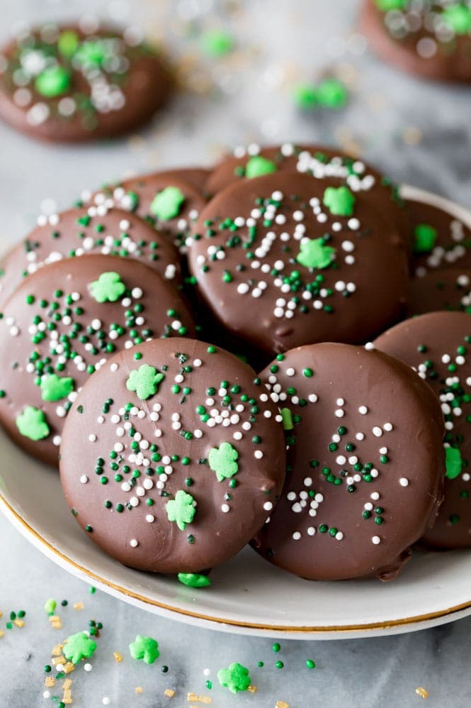 A plate full of copycat Thin Mint cookies decorated with festive St. Patrick's Day sprinkles