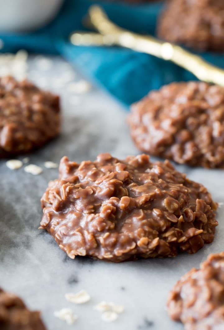 Chocolate Peanut Butter No Bake Cookies on a marble slab. Shiny and chocolatey.