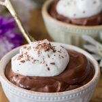 Bowl of chocolate pudding, topped with whipped cream