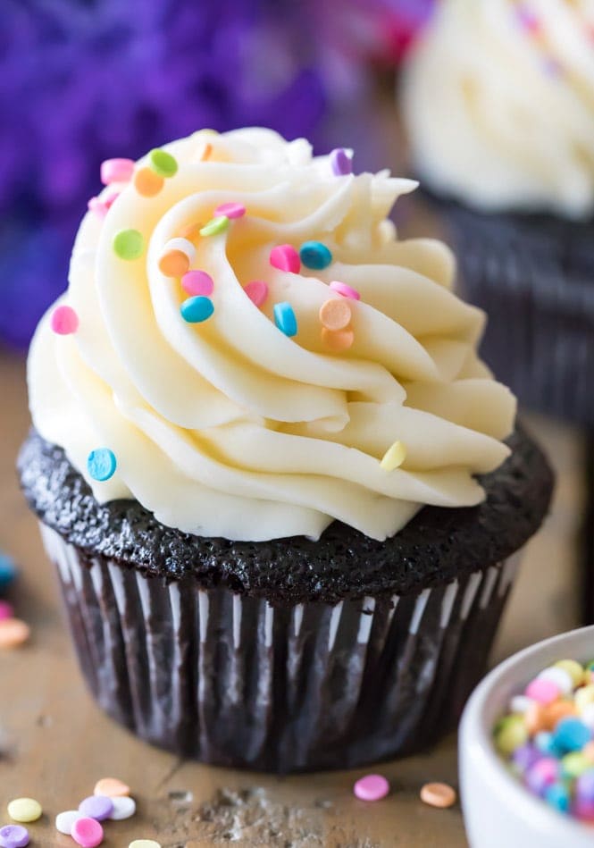 Vanilla frosting on a chocolate cupcake