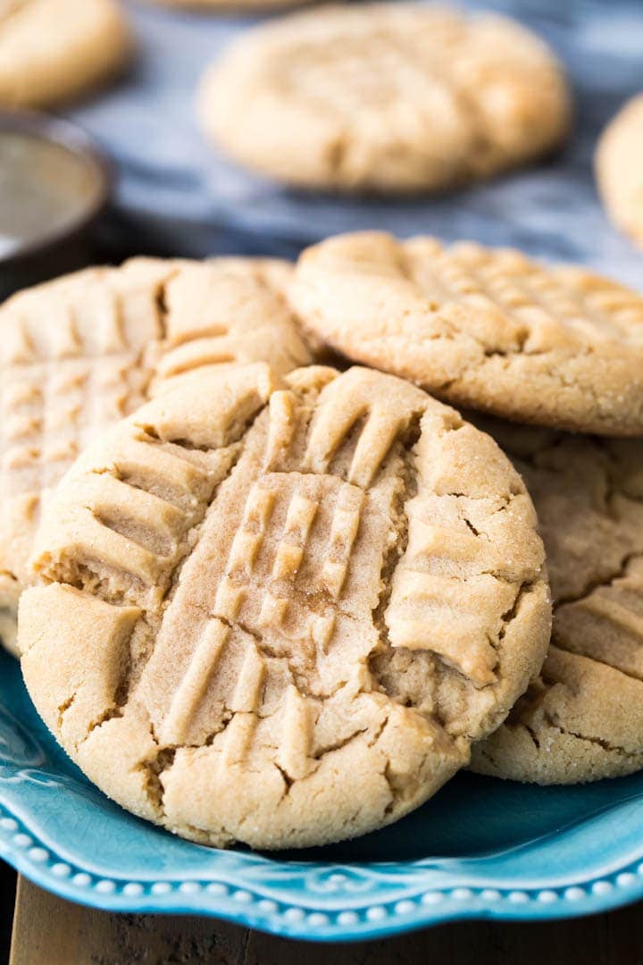 Big soft peanut butter cookies on a blue plate