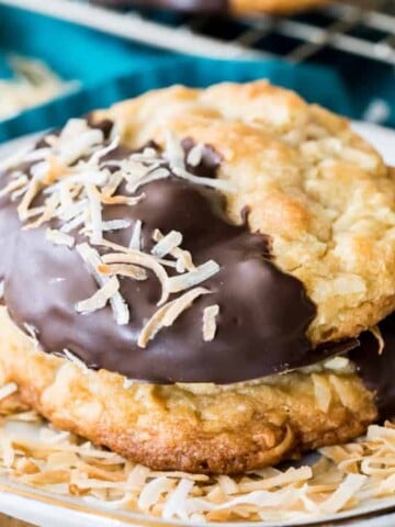 Chocolate dipped coconut cookie with toasted coconut flakes