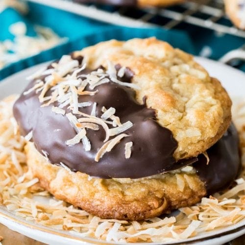 Chocolate dipped coconut cookie with toasted coconut flakes