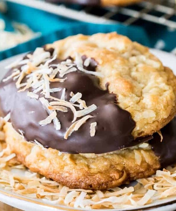 Chocolate dipped coconut cookie with toasted coconut flakes