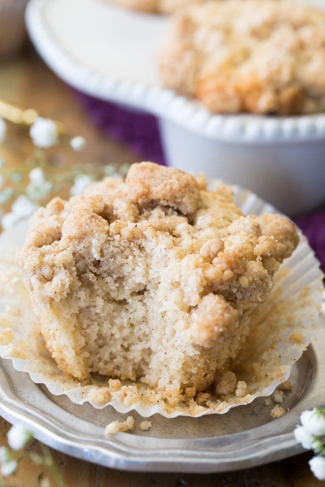 A freshly baked coffee cake muffin that's been bitten into