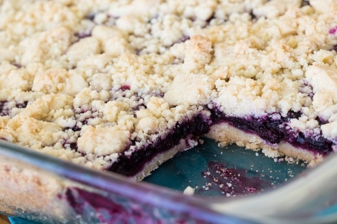 Blueberry crumb bars in a glass pan