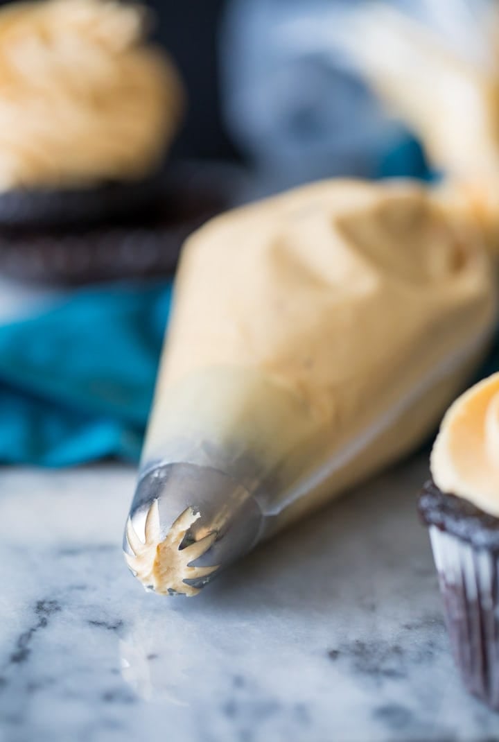 peanut butter frosting in a piping bag
